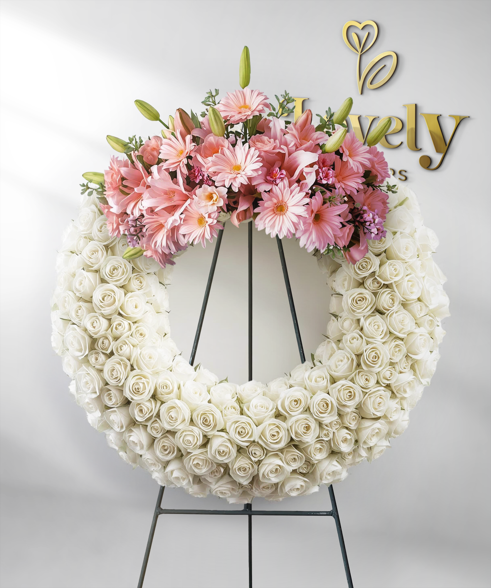white lily funeral wreath Elegant White Rose Funeral Wreath with Pink Gerberas & Lily Accents