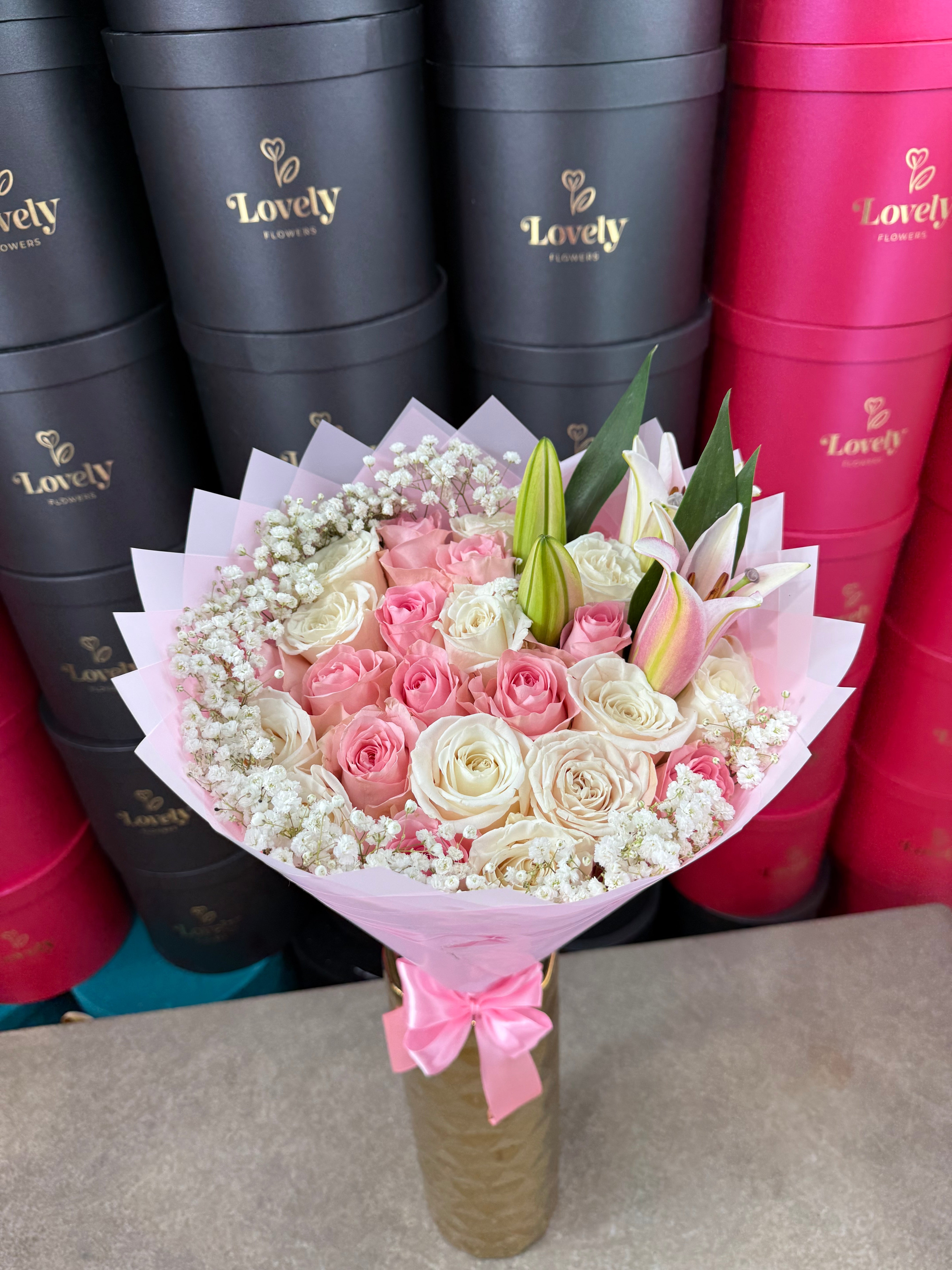 white roses and lilies arrangements 25 White & Pink Roses + Baby Breath + Lilies