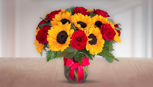 Girasoles y rosas rojas