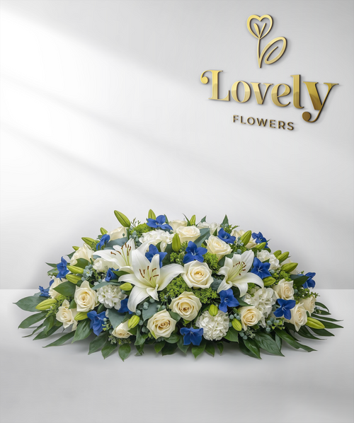 Elegant White Lily and Royal Blue Floral Casket Spray