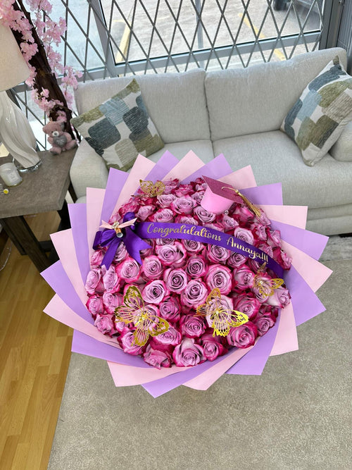 75 Purple Roses + Graduation Decor