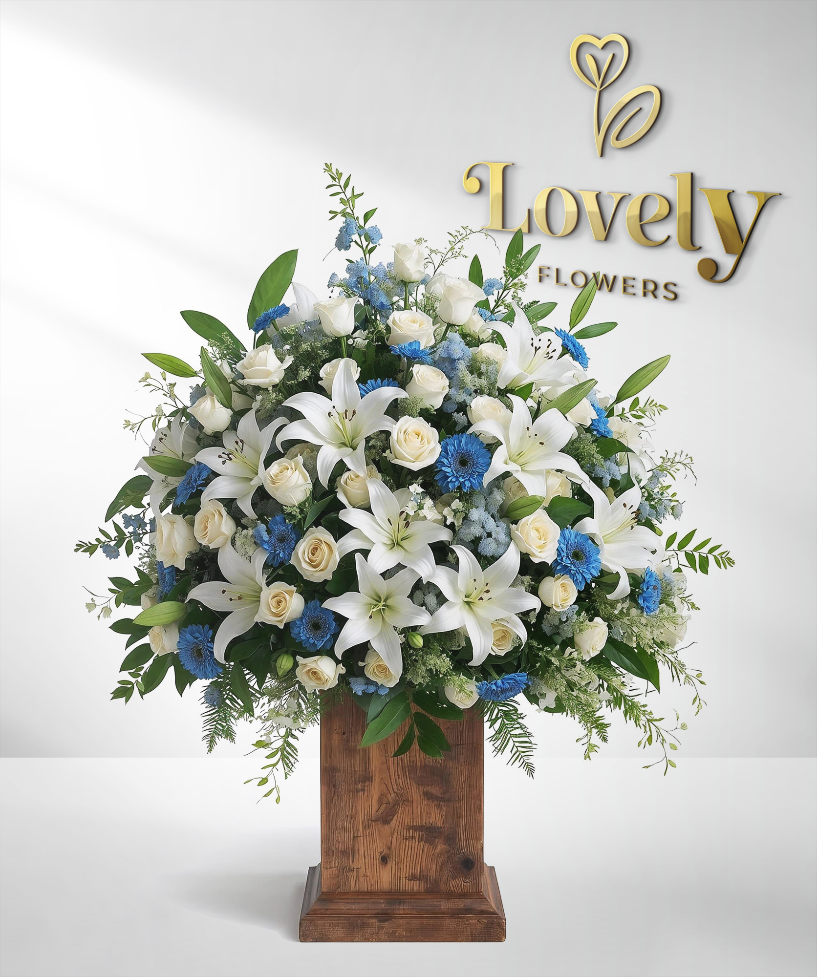 Stately White Roses,Lily and Blue Gerber Centerpiece