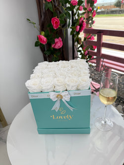 25 White Everlasting Roses in blue box
