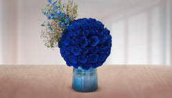 Blue Roses in Glass Vase