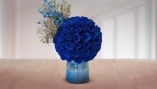 Blue Roses in Glass Vase